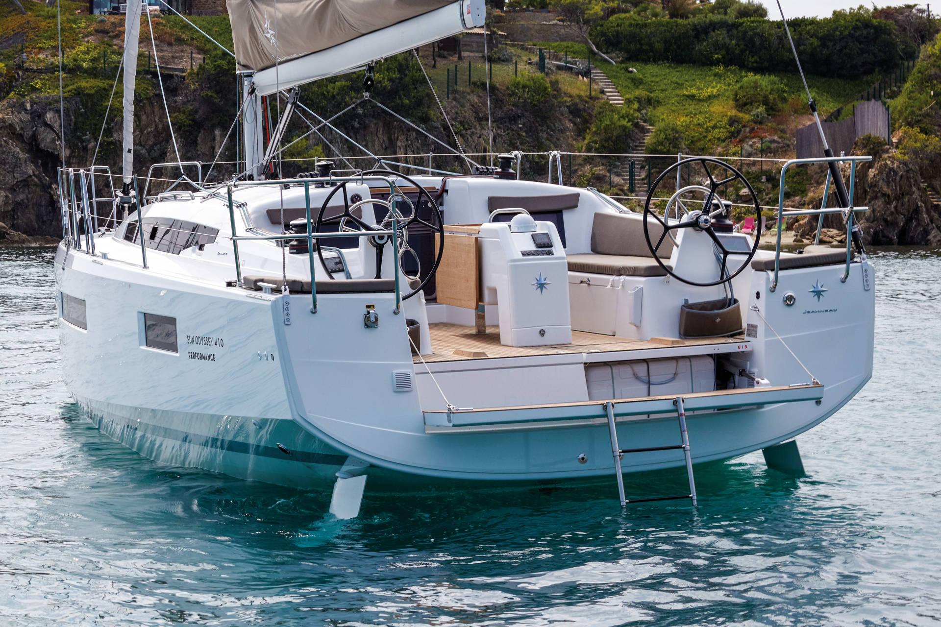 A Jeanneau Sun Odyssey 410 stern-to in a quiet cove